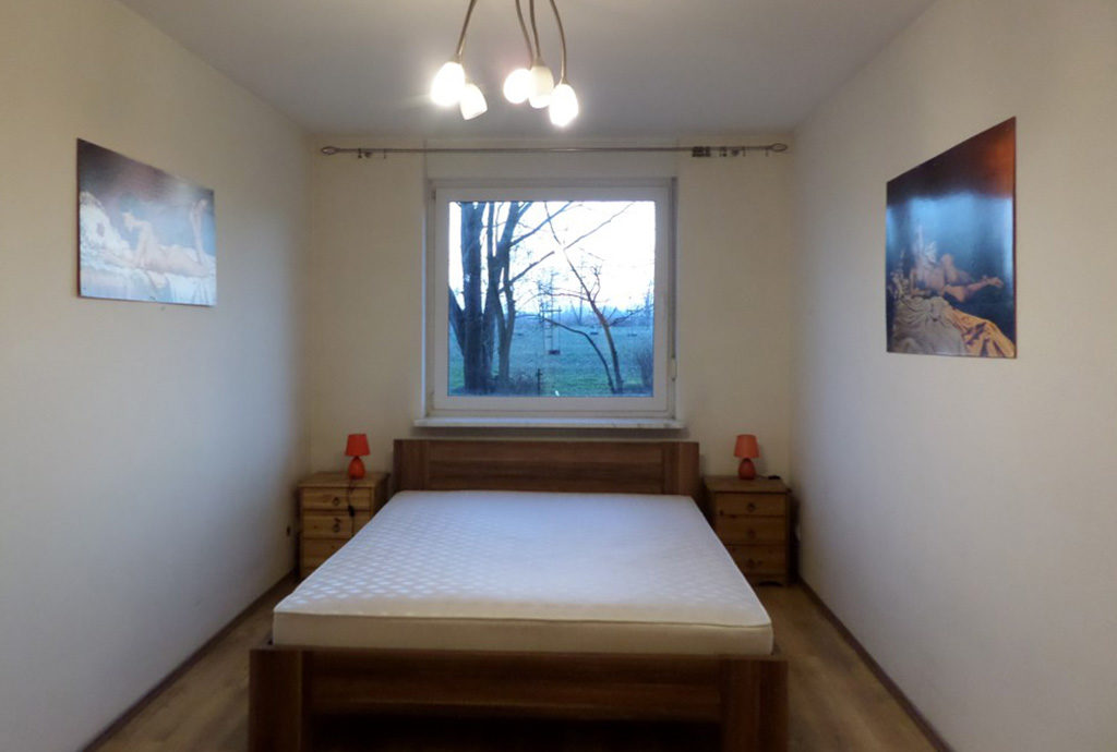 widok na elegancką sypialnię w mieszkaniu do wynajmu Wrocław