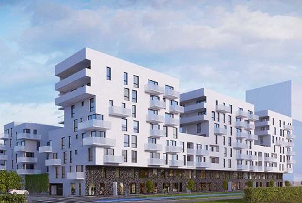 rzut od strony ulicy pokazujący nowoczesny apartamentowiec we Wrocławiu, w którym znajduje się oferowane do sprzedaży mieszkanie