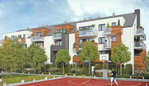 widok od strony boiska do koszykówki na budynek, w którym usytuowane jest mieszkanie do sprzedaży Wrocław Krzyki